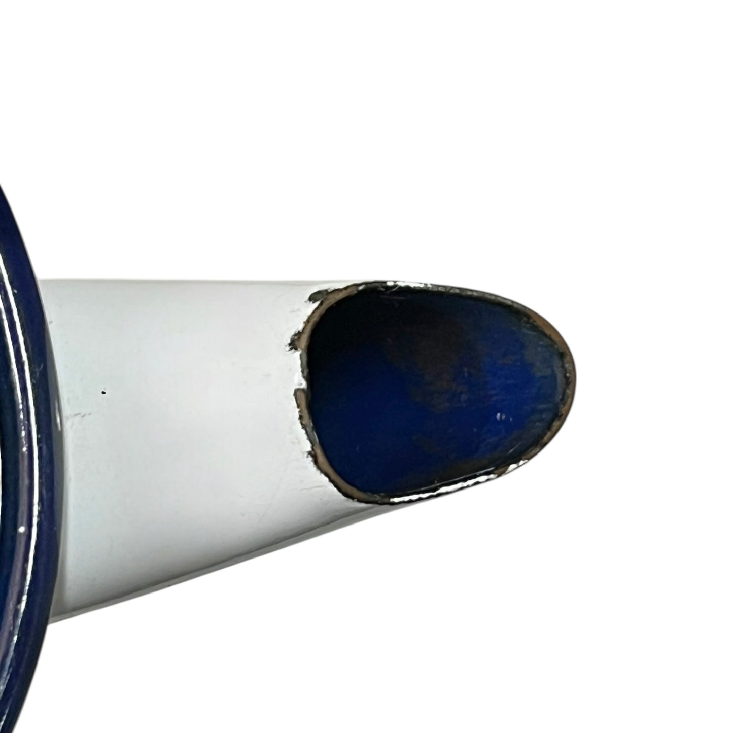 Close up of an enamel coffee pot on a white background