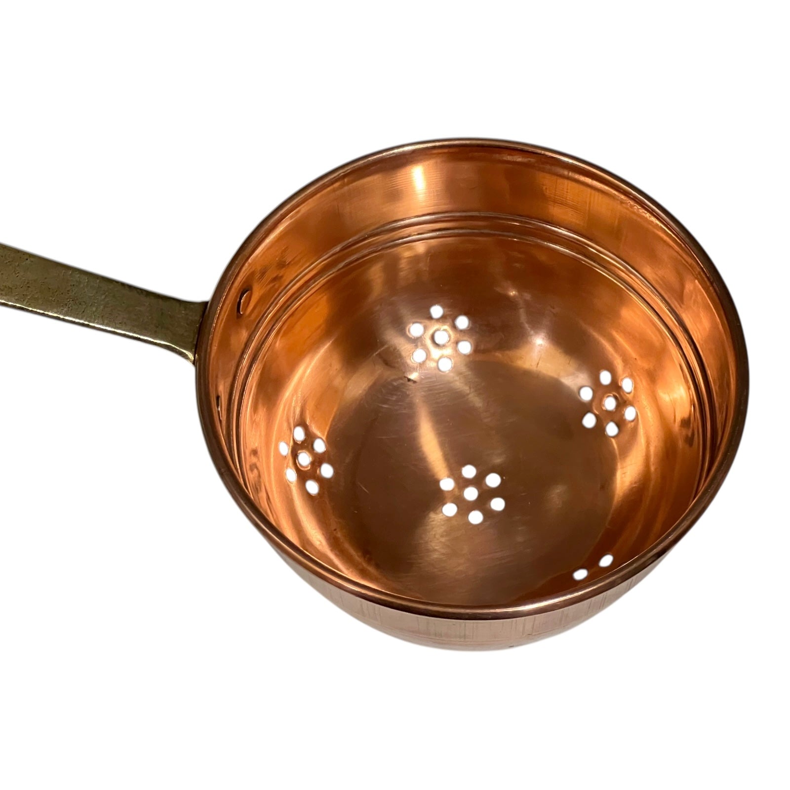 Small copper French sieve with a brass handle on a white background
