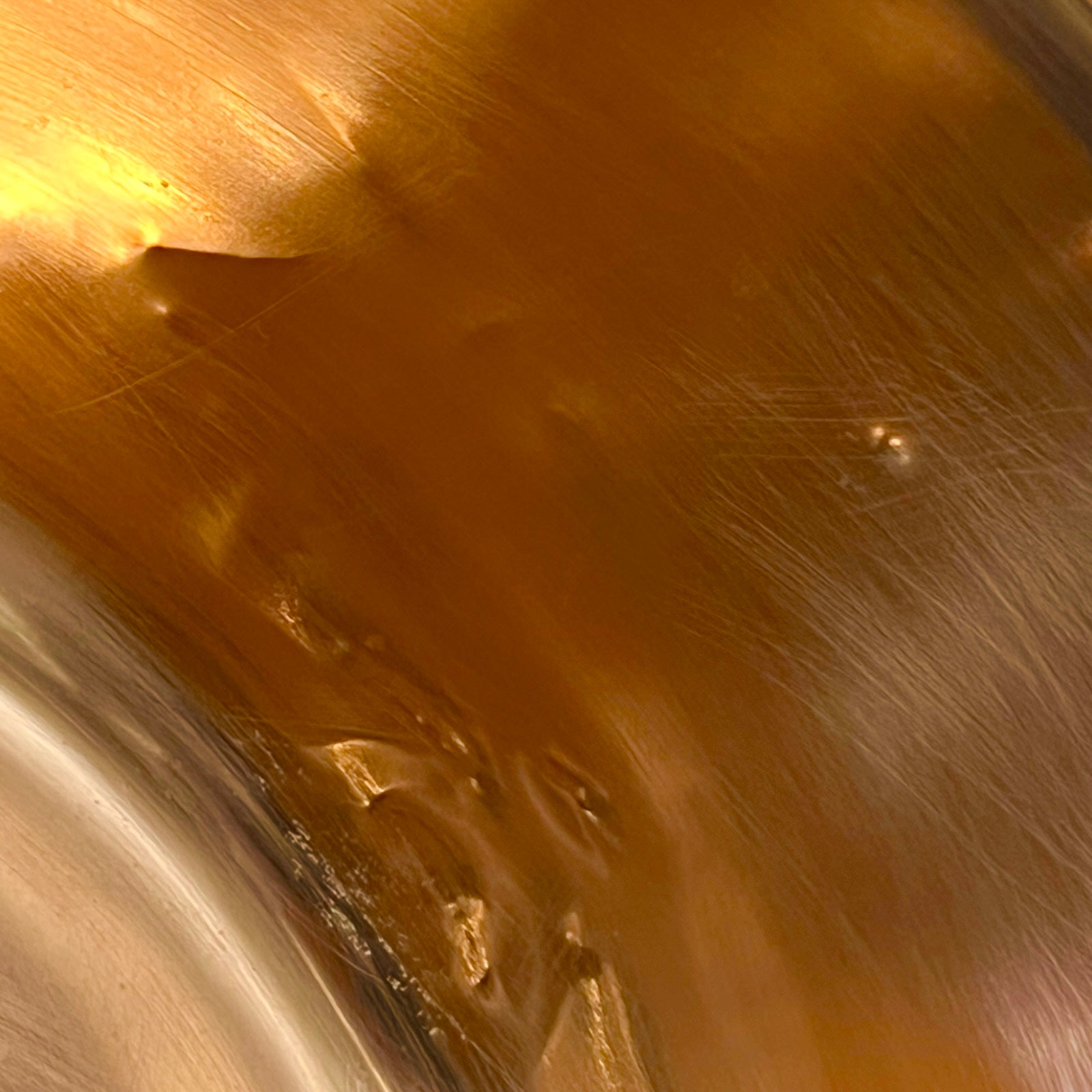 Close up of a French copper bathroom basin on a white background