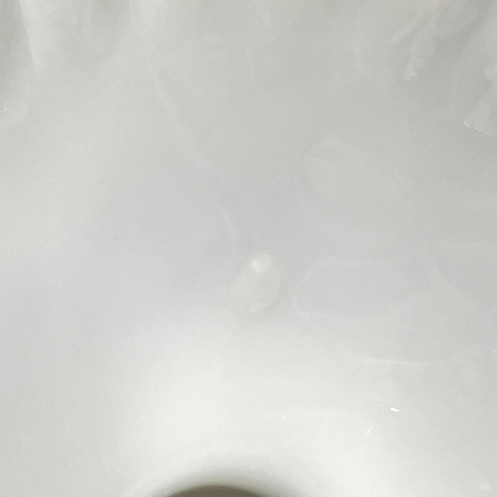 close up condition view of a milk glass lampshade