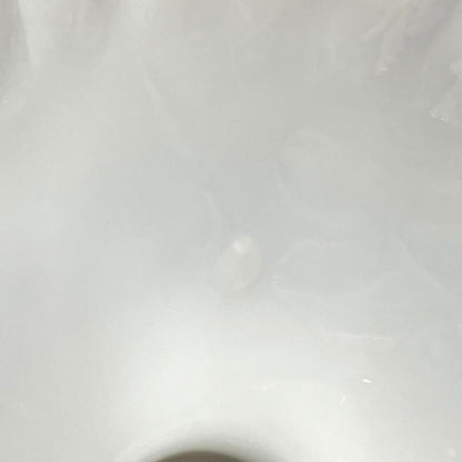 close up condition view of a milk glass lampshade