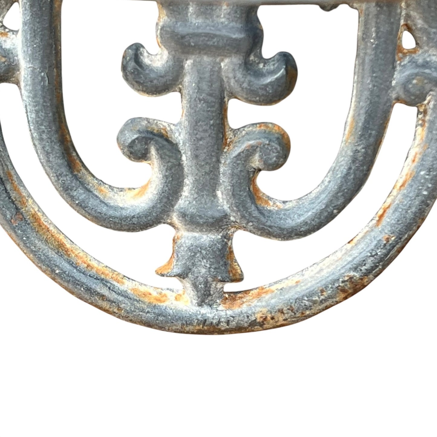 close up of a metal decorative wall planter on a white background