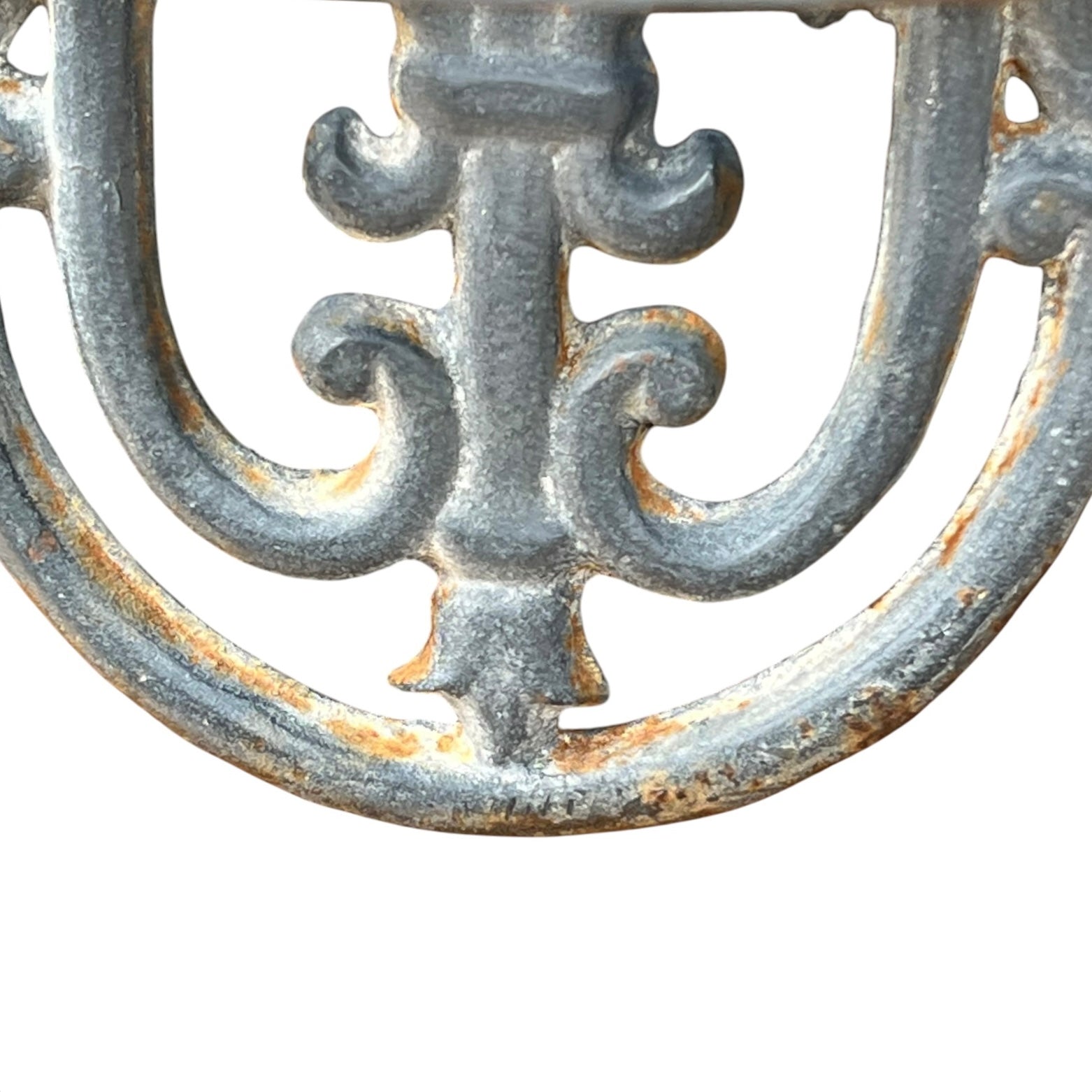 close up of a metal decorative wall planter on a white background