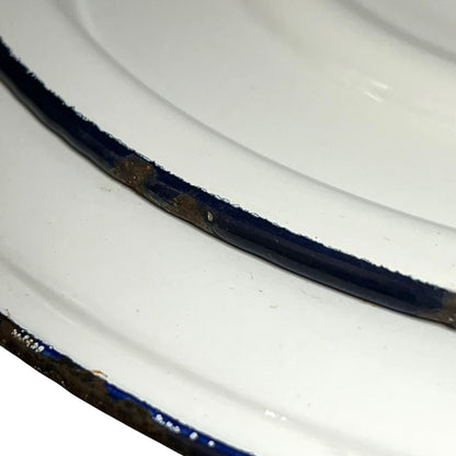 Close up of a vintage enamel lidded white bucket on a white background