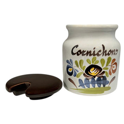 Ceramic jar labeled 'Cornichons' with decorative design on a white background