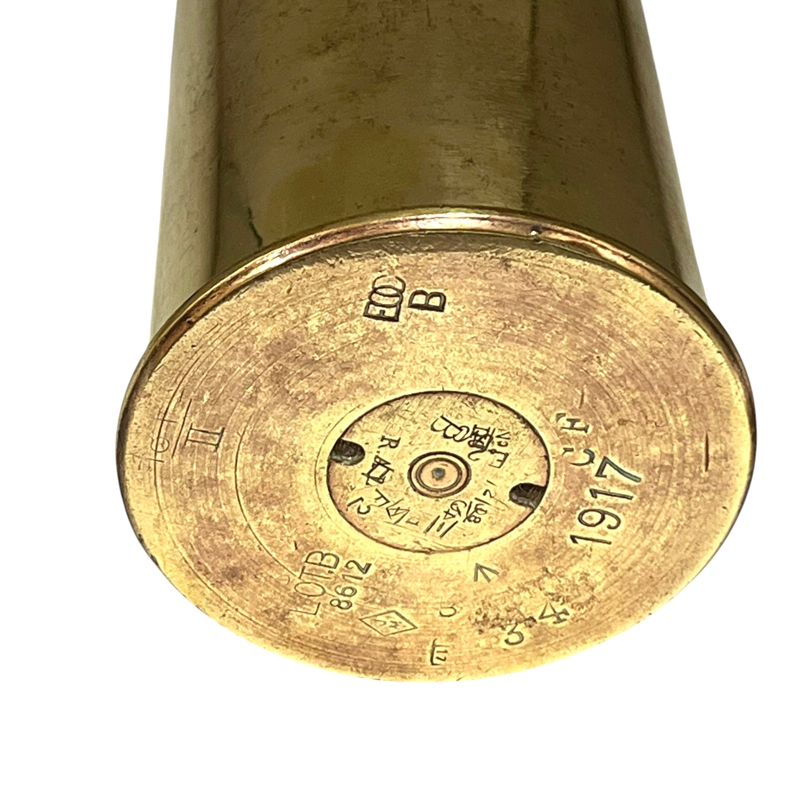 Brass ww1 British militaria polished brass shell case base dated 1917 on a white background 