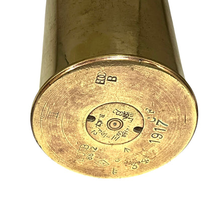Brass ww1 British militaria polished brass shell case base dated 1917 on a white background 