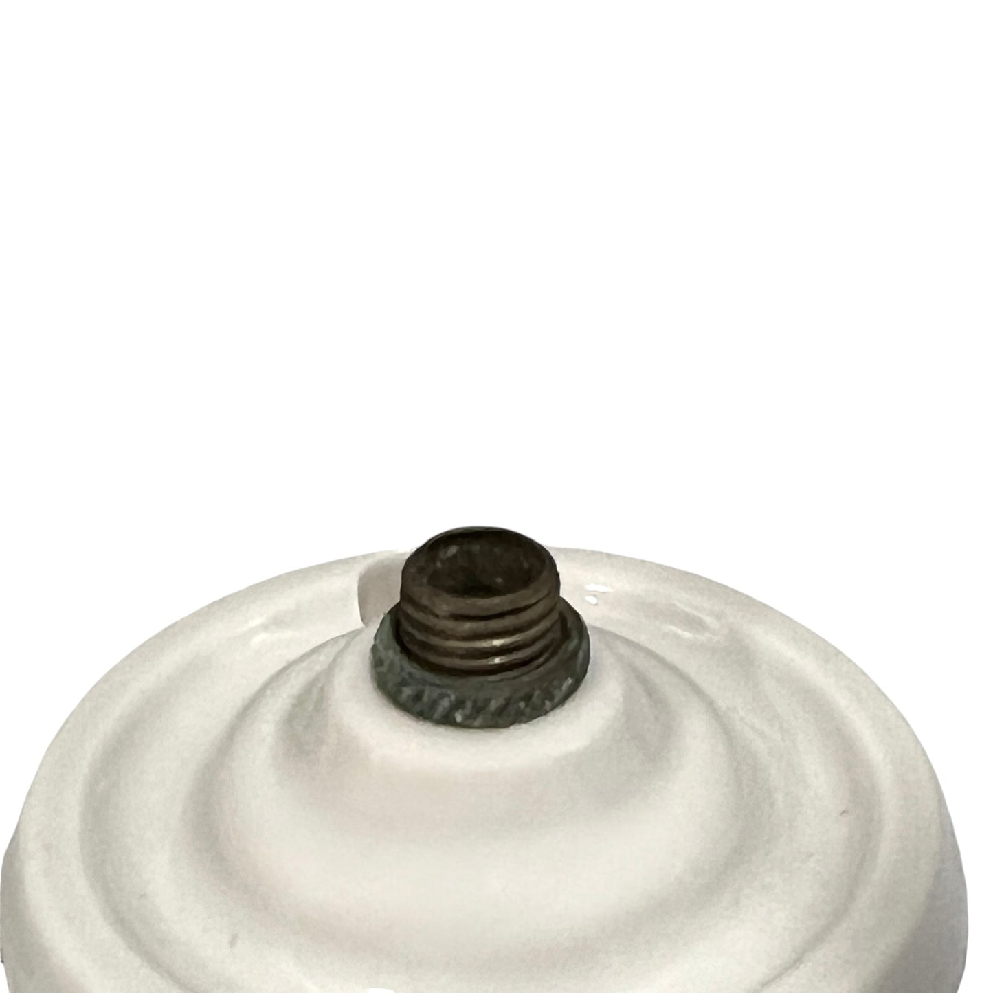 Small vintage French porcelain ceiling rose with a brass nut on a white background 