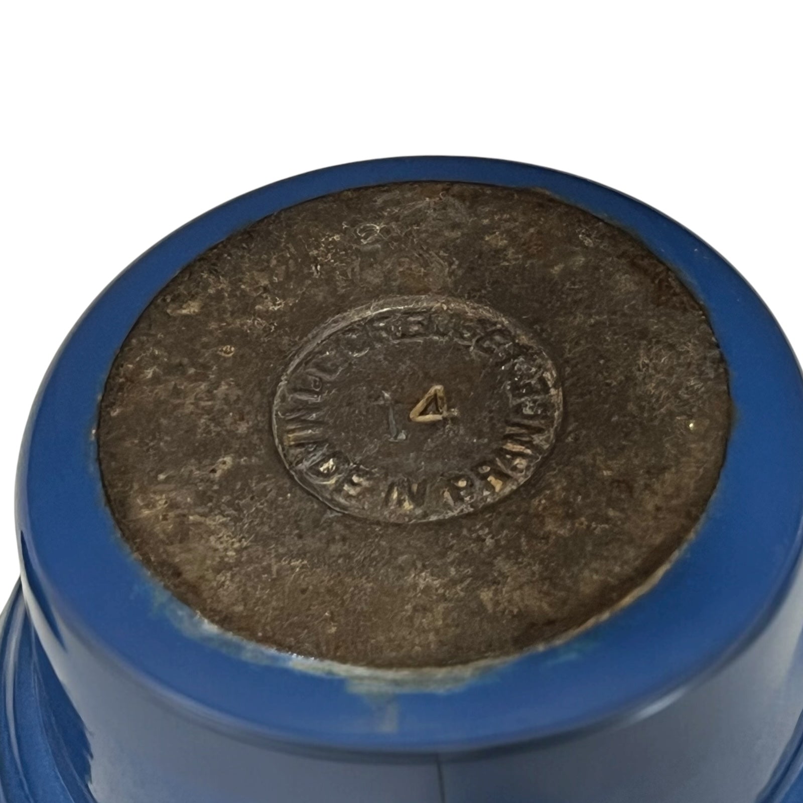 base of blue Le Creuset cocotte