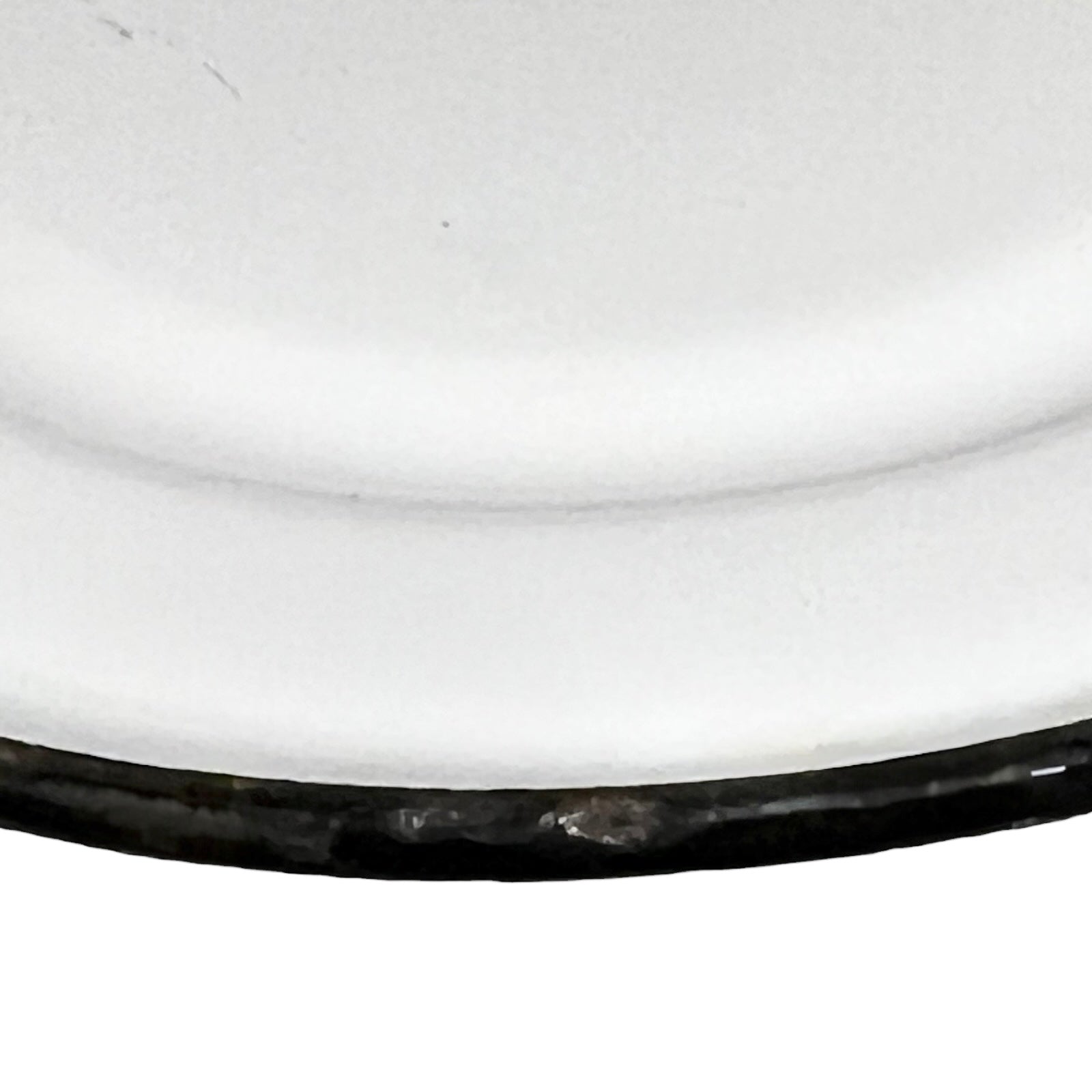 Close up of an enamel coffee pot on a white background