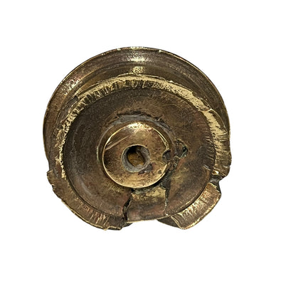 Close up of WW1 relic brass fuse on a white background