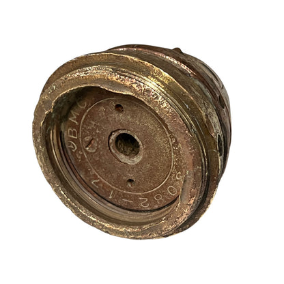 Close up of WW1 brass fuse on a white background