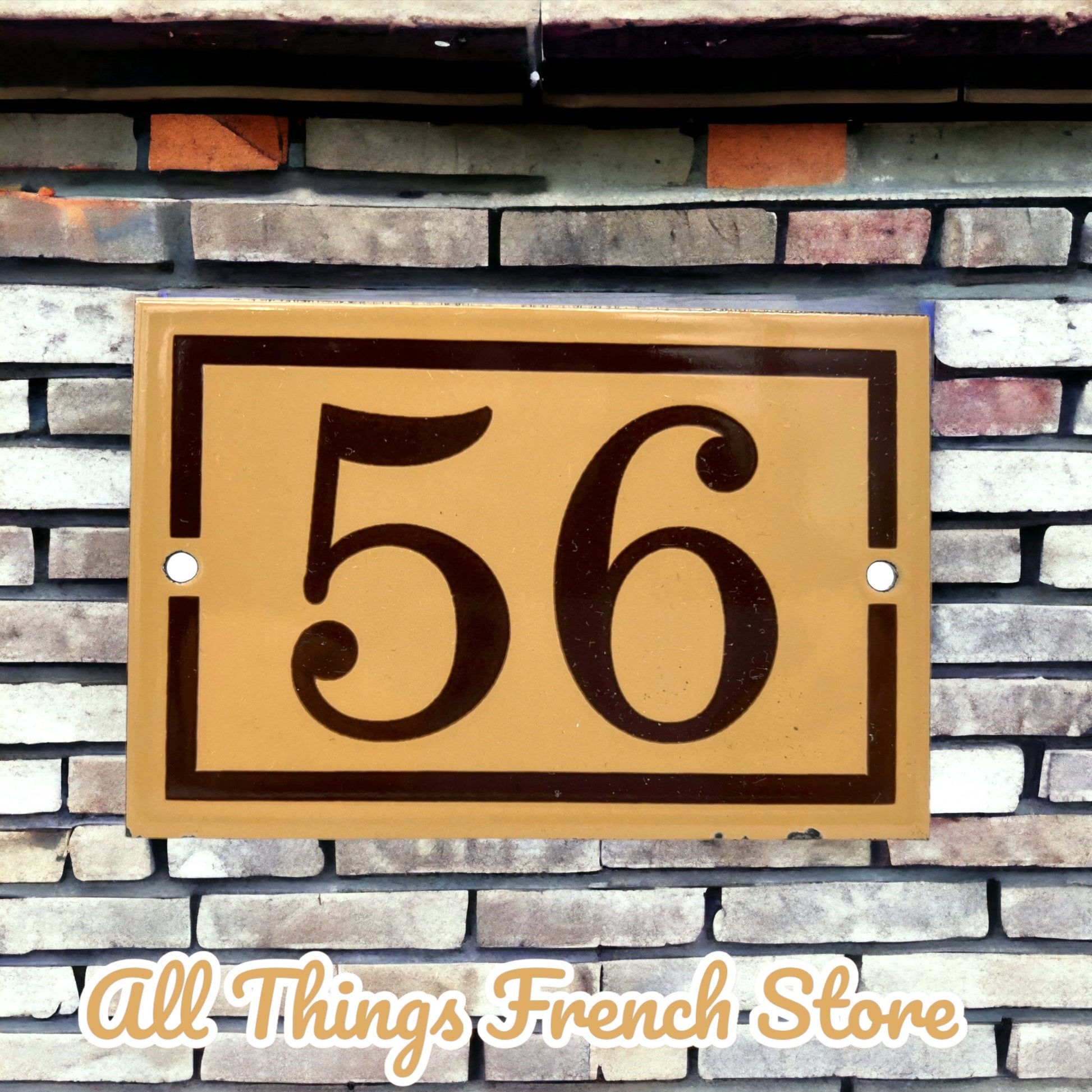 image French enamel house door number 56 on a brick wall