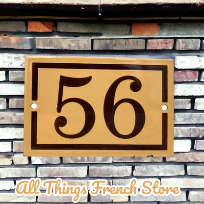 image French enamel house door number 56 on a brick wall