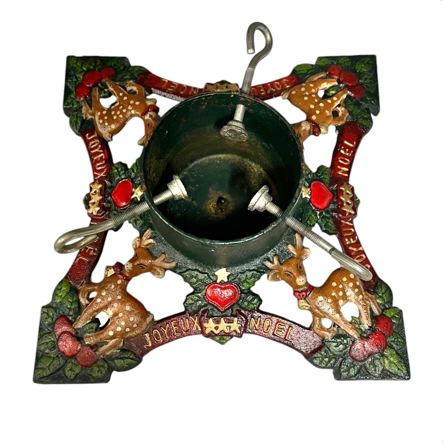 Decorative Christmas Tree holder with reindeer, berries, and 'Joyeux Noel' text on a white background