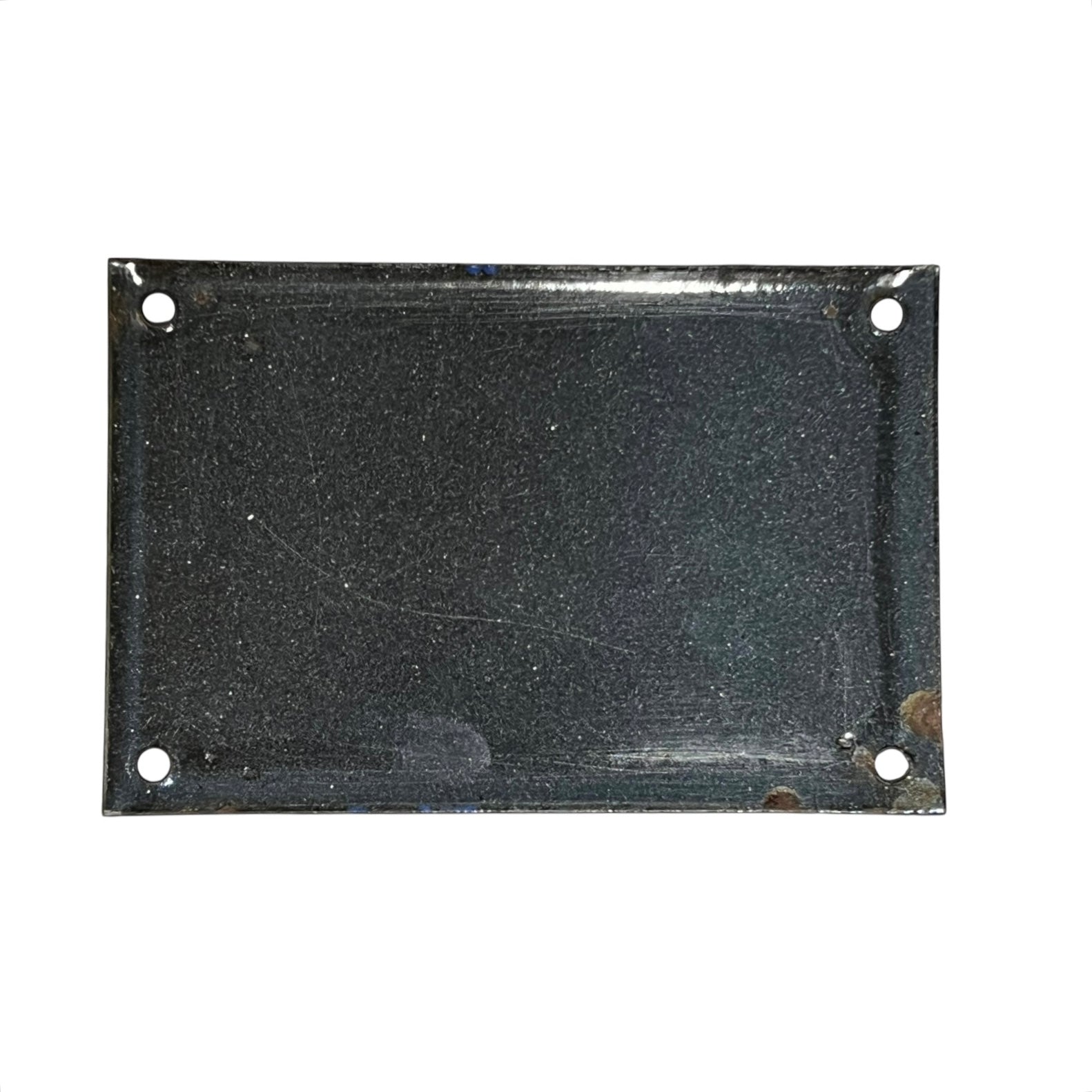Rectangular black metal plate with holes on a white background