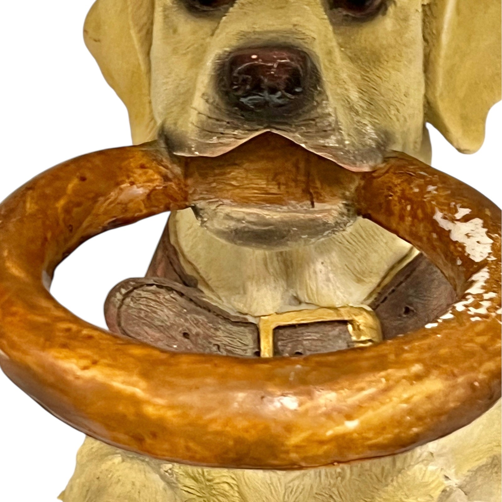 Dog shaped umbrella stand with a wooden ring on a white background