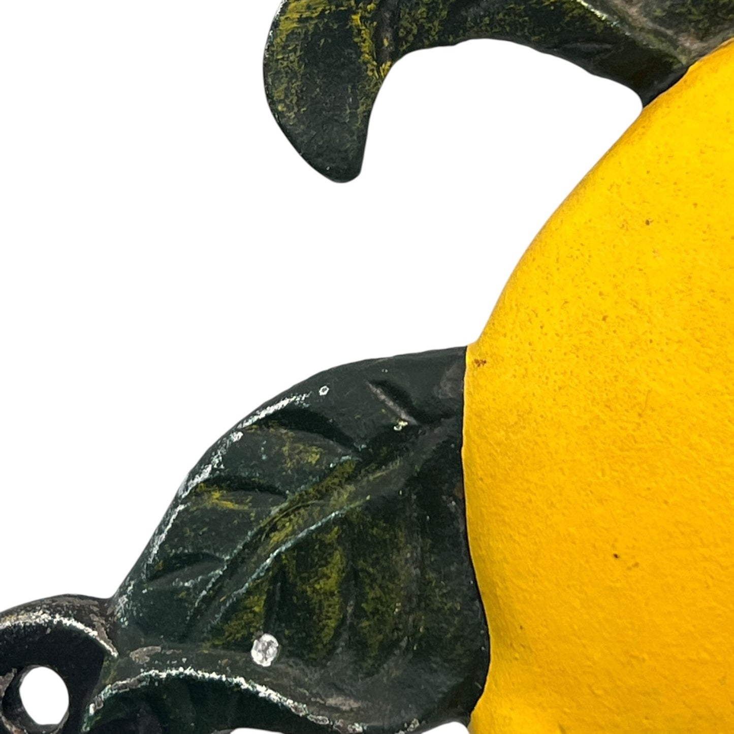 close up of a cast iron kitchen roll holder on a white background 