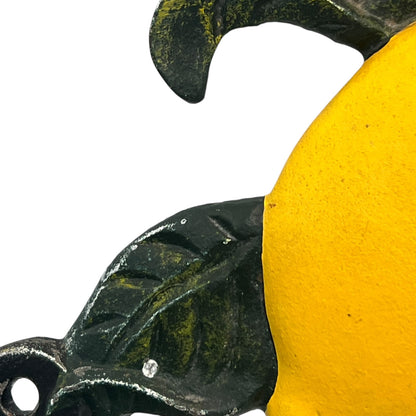 close up of a cast iron kitchen roll holder on a white background 