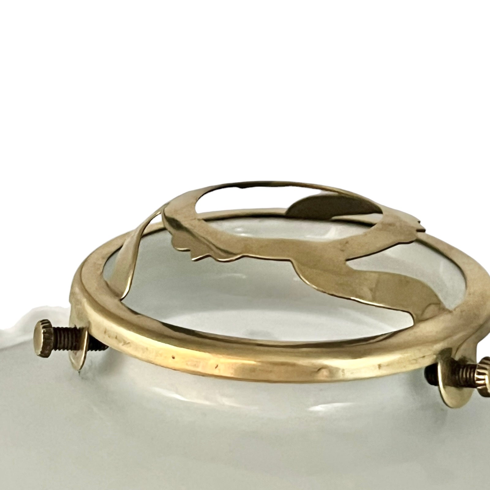 Close-up of a brass light gallery on a white background