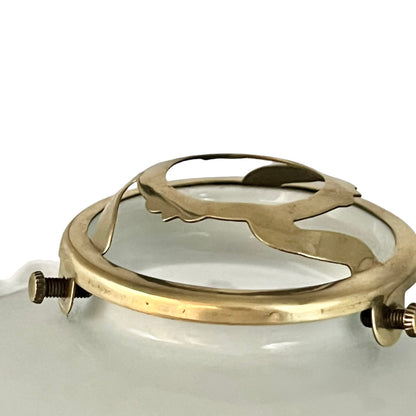 Close-up of a brass light gallery on a white background