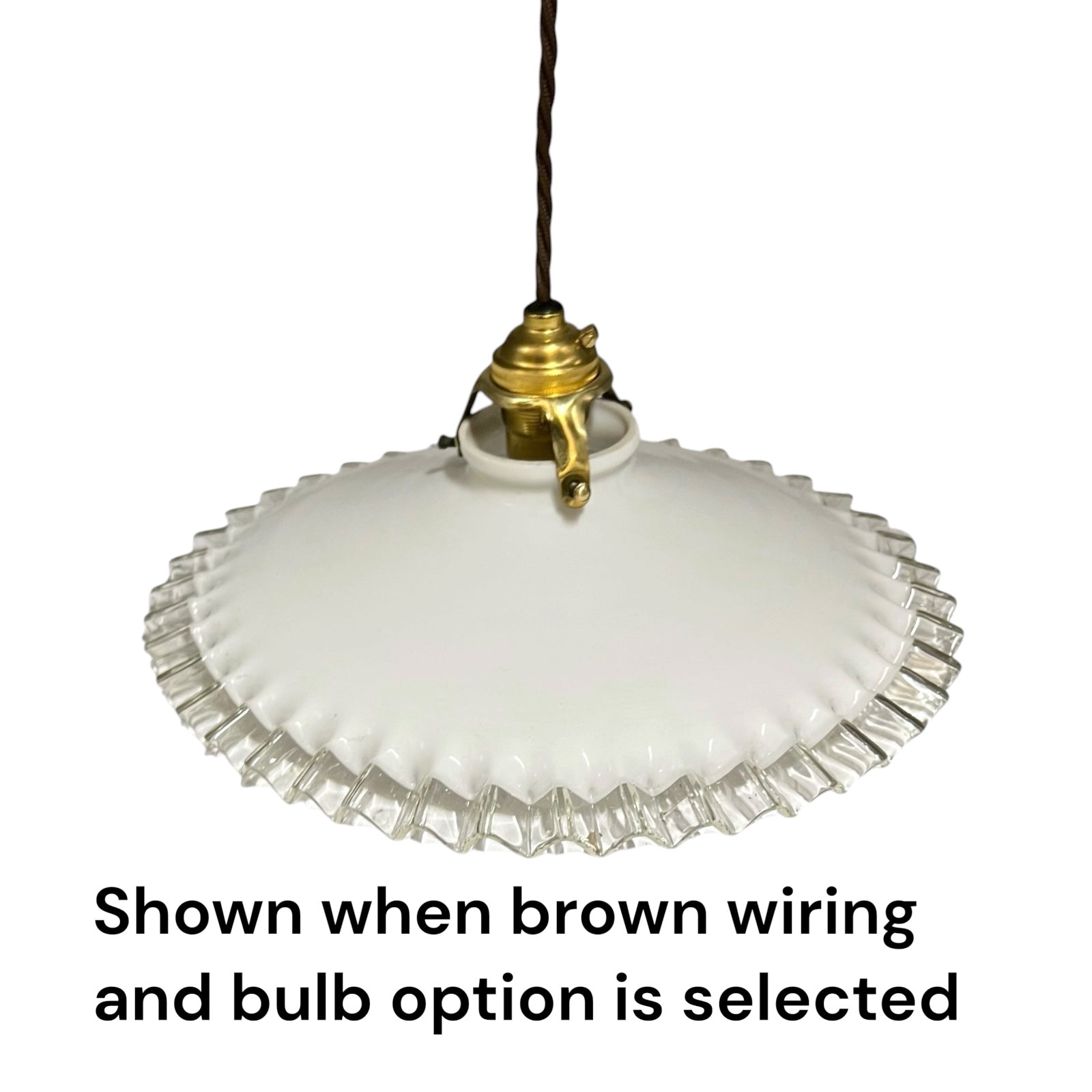 A vintage-style pendant light with a white ribbed glass shade and a brass fixture, suspended by a brown cord against a white background, with text below reading 'Shown when brown wiring and bulb option is selected'.