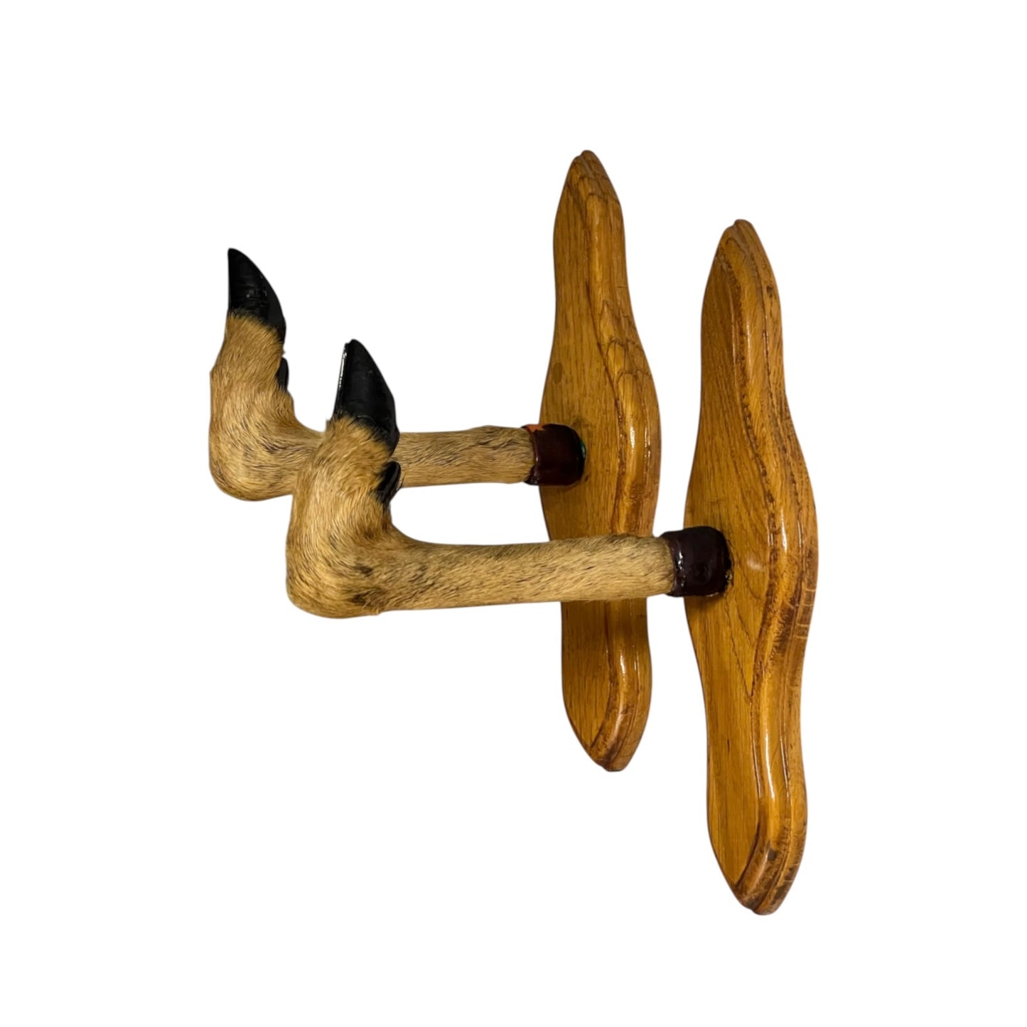 A rustic wooden wall-mounted decorative taxidermy deer hooves attached to two wavy wooden plaques on a plain white background.