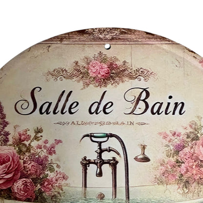 Decorative sign with 'Salle de Bain' text and vintage bathroom elements on a floral background.