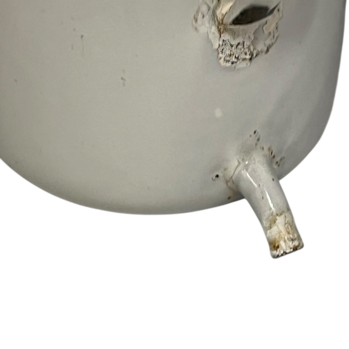 close up image of vintage planter spout
