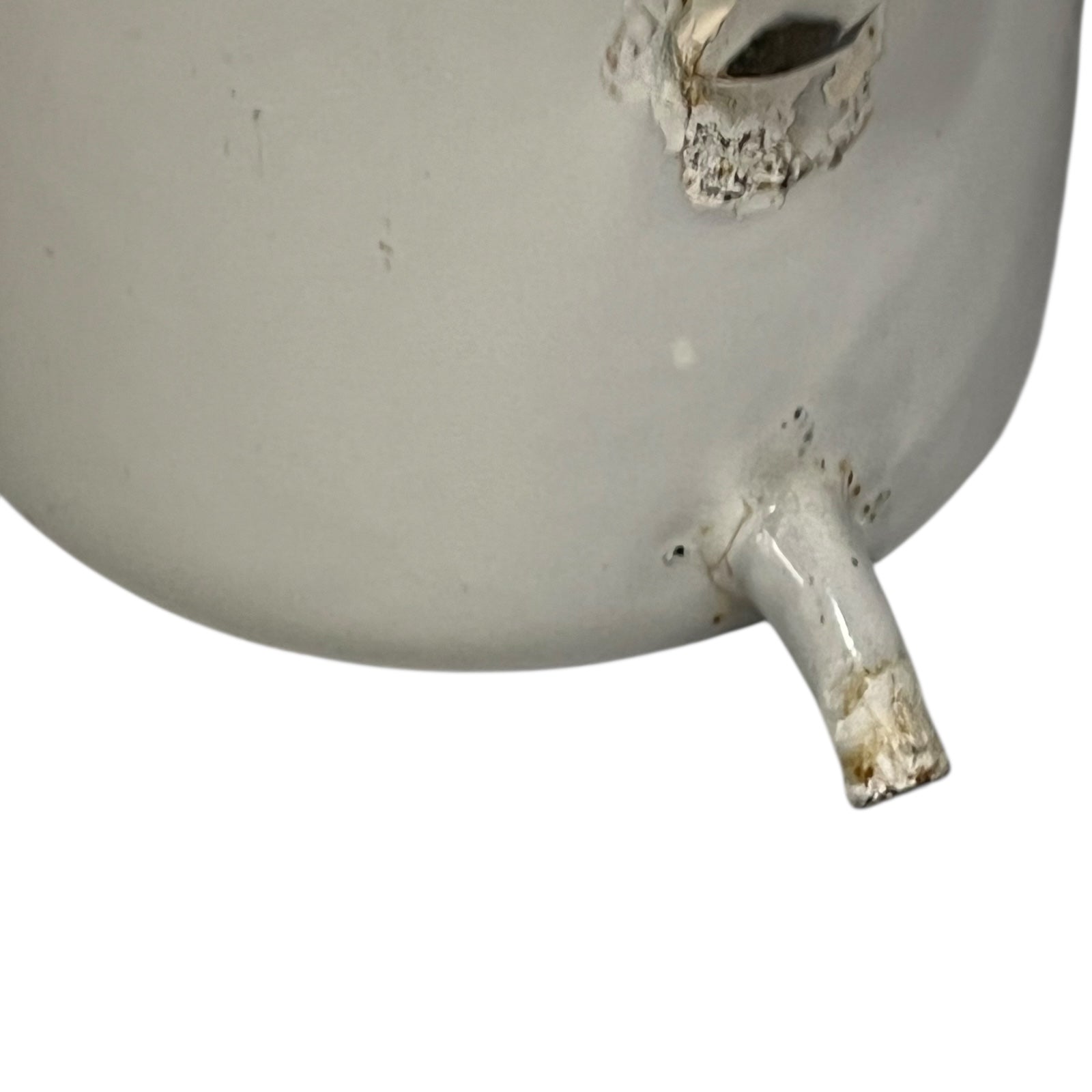 close up image of vintage planter spout