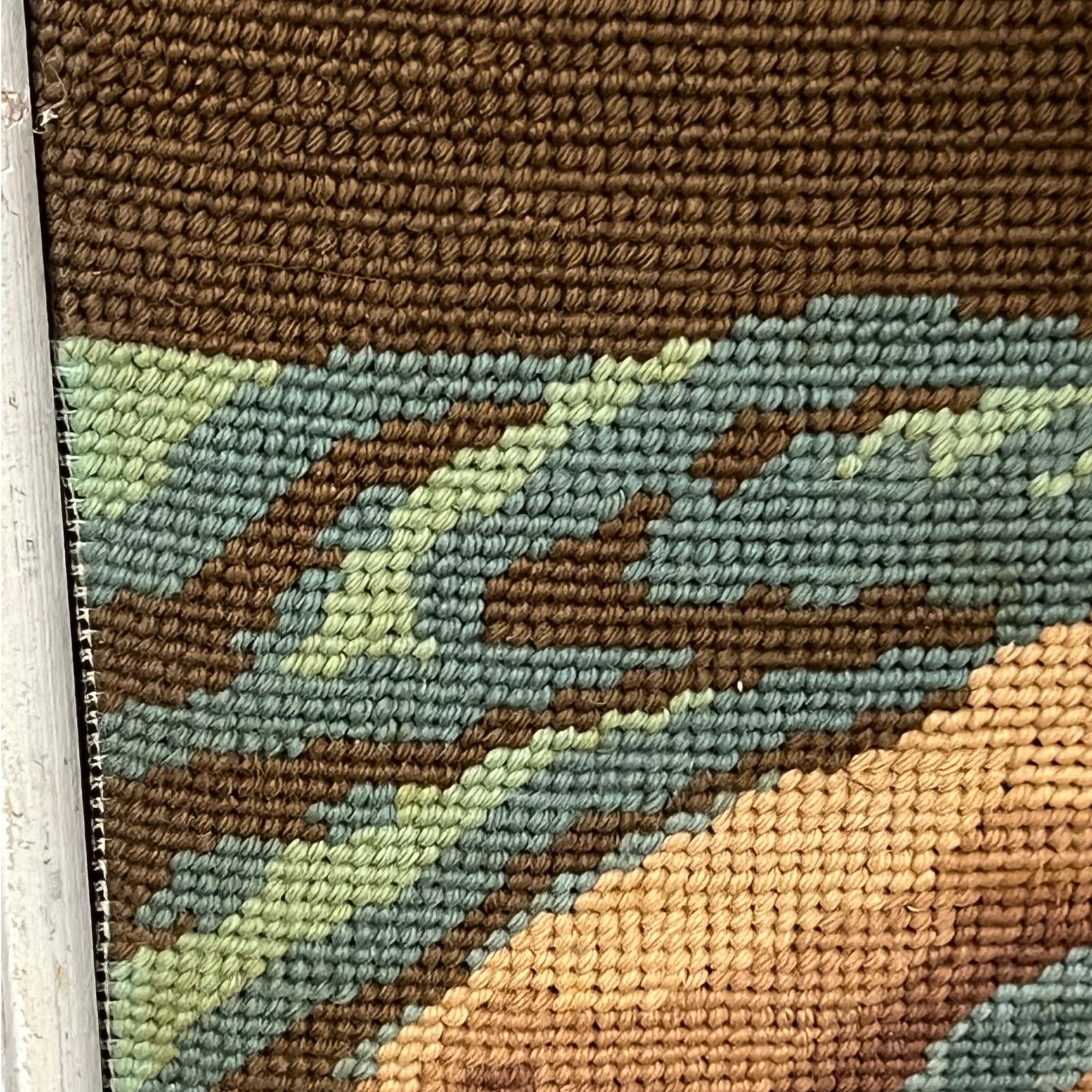 close up of a French vintage tapestry on a white background