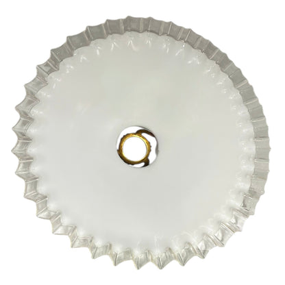 Round white light fixture with decorative edge on a white background