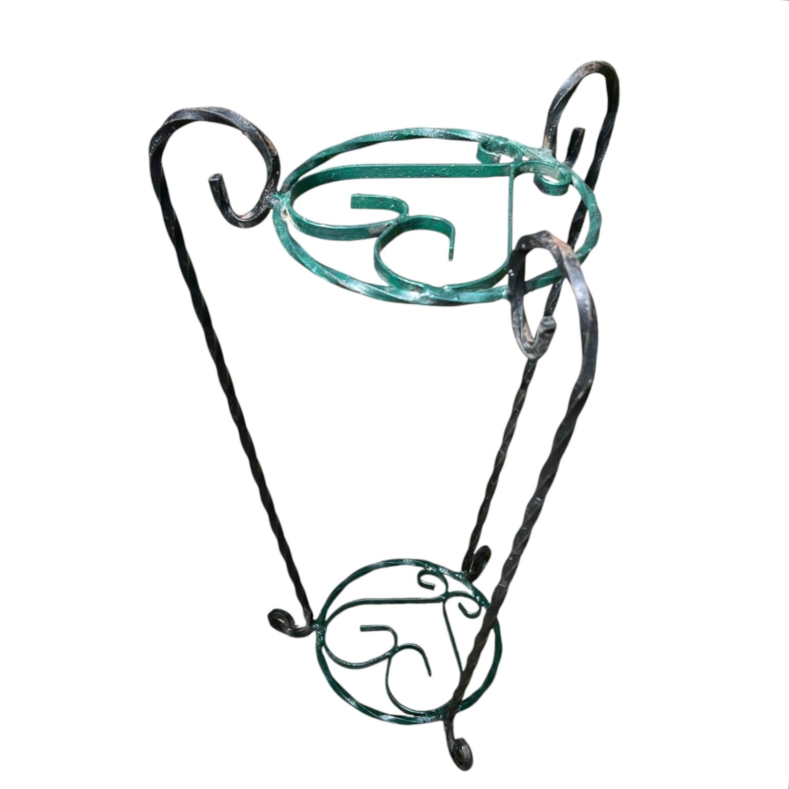 Green and black wrought iron jardinière scrolled plant stand on a white background