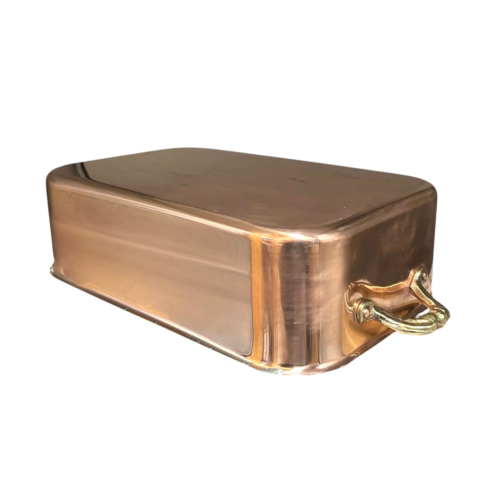 Copper roasting pan with tin lining on a white background