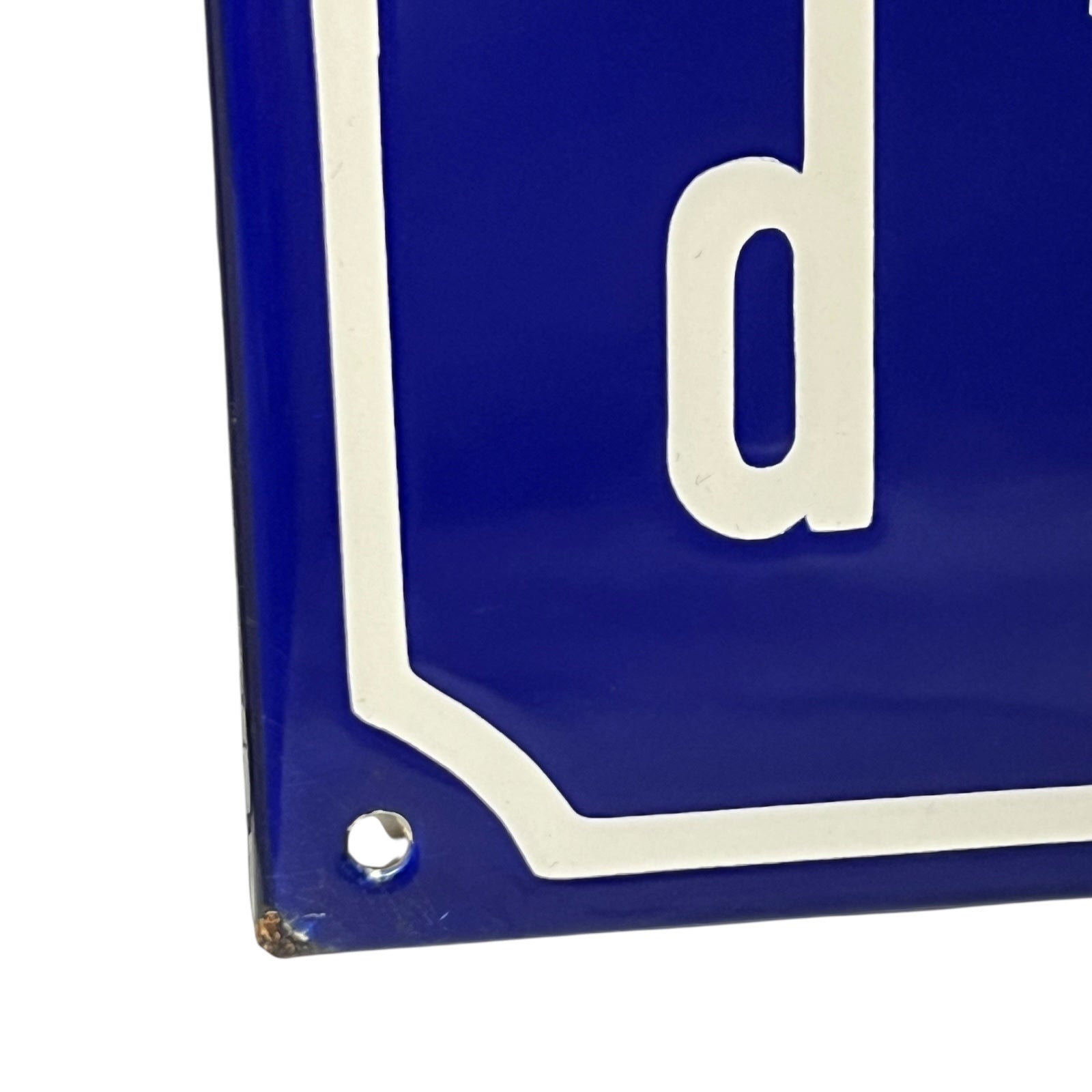 Close-up of a blue and white sign  on a white background