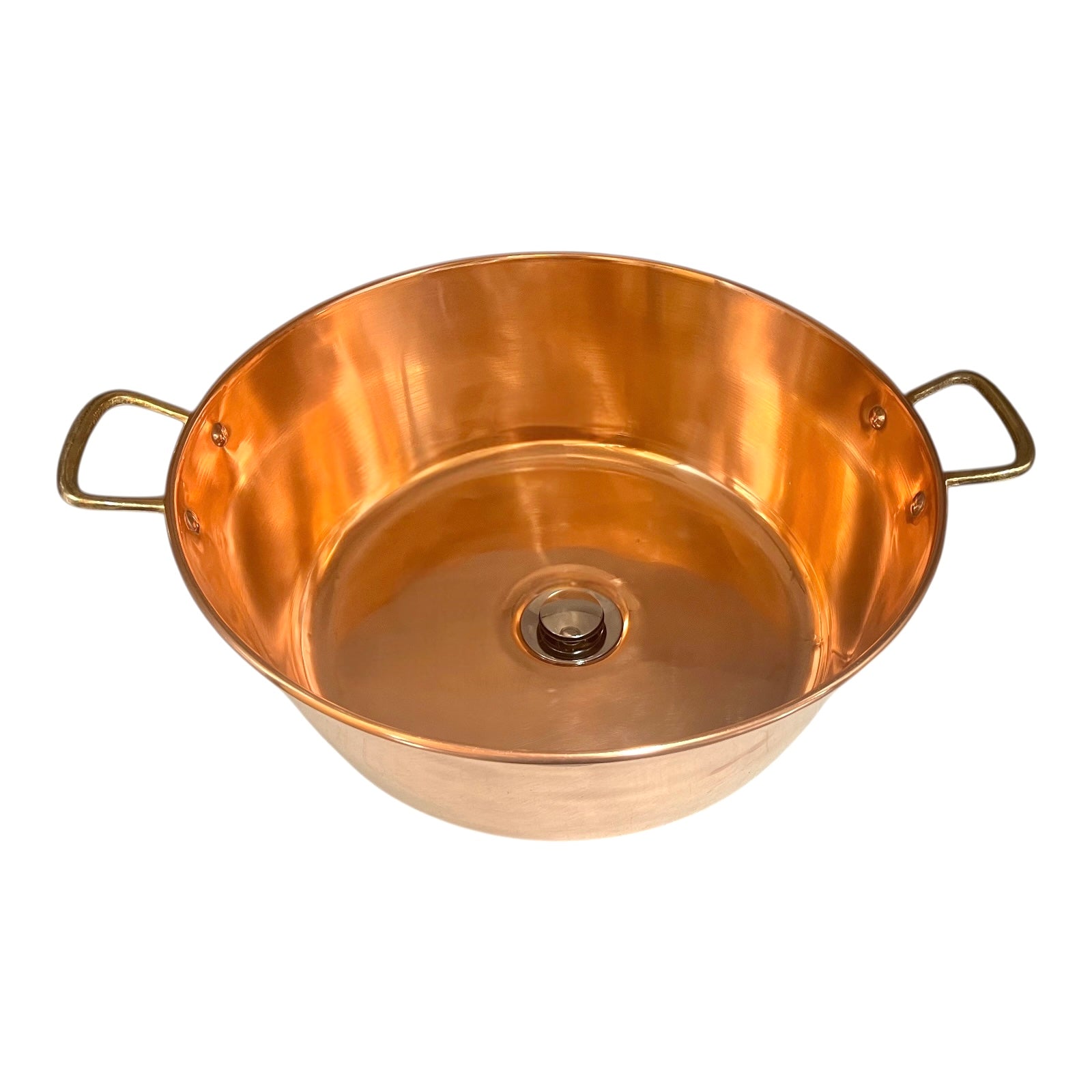 Copper basin with brass handles on a white background