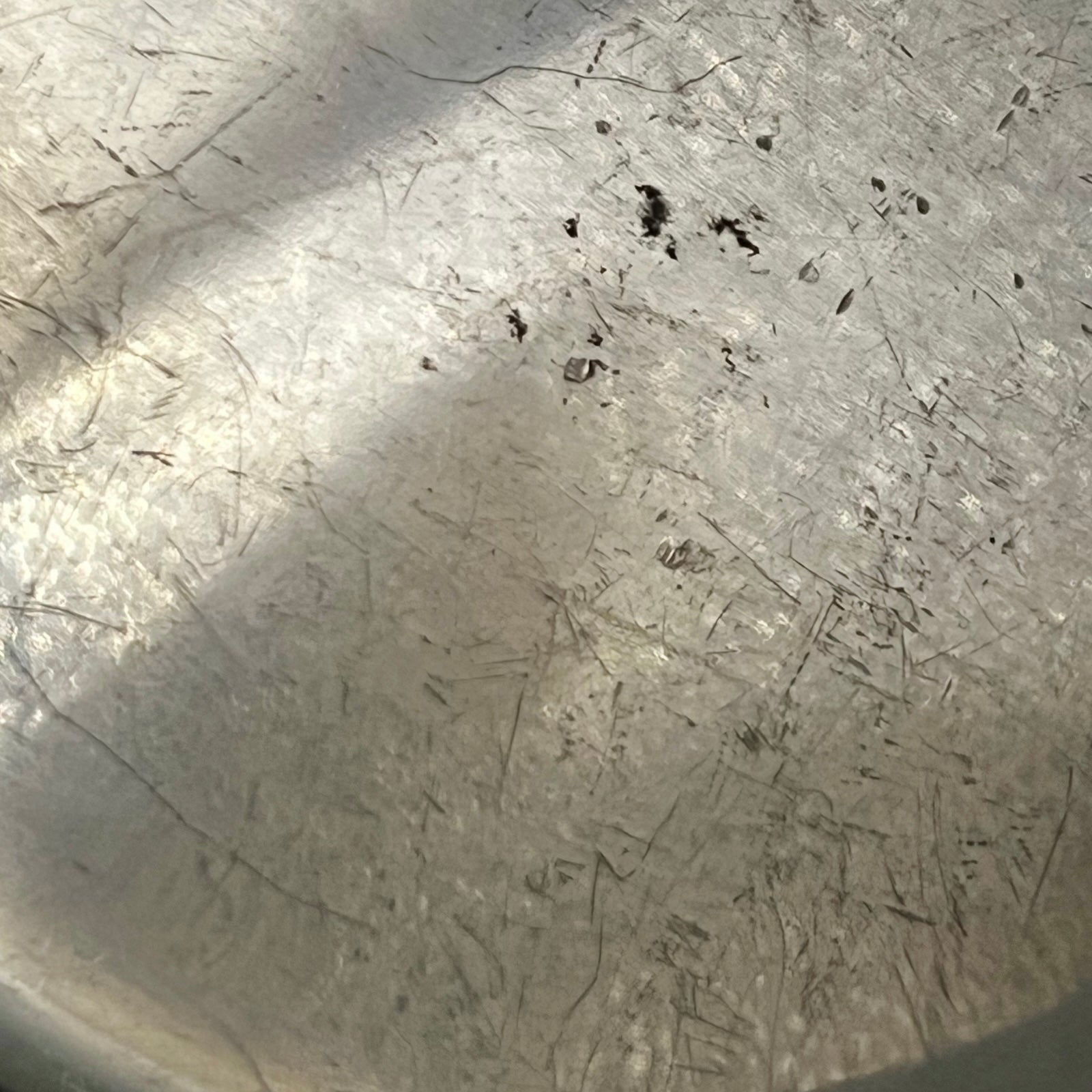 Close-up of the inner of a  copper pot handle on a white background