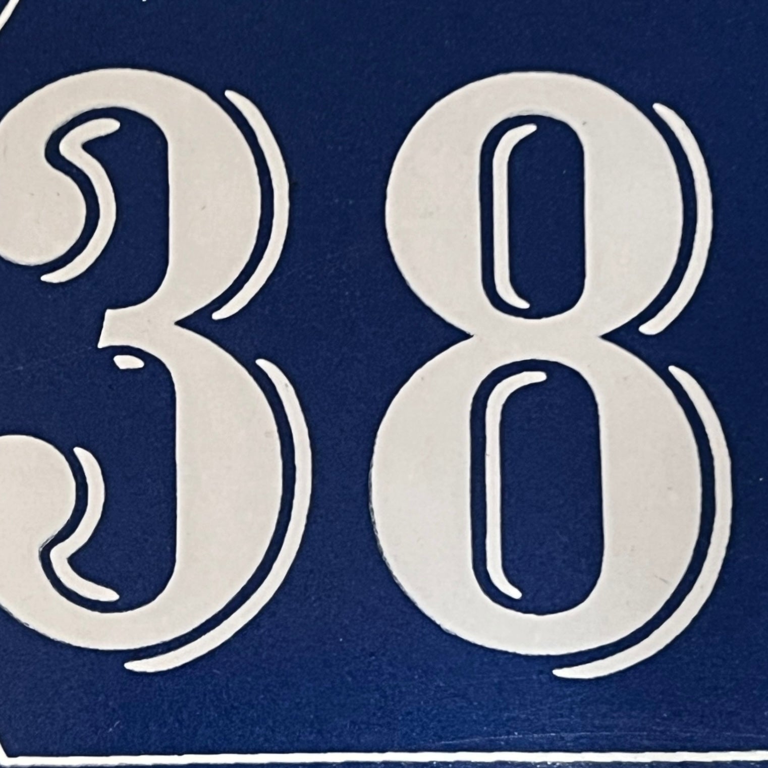 White number '384' on a blue background