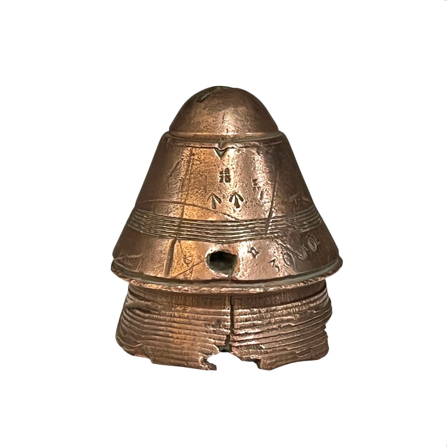 WW1 brass fuse paperweight on a white background 