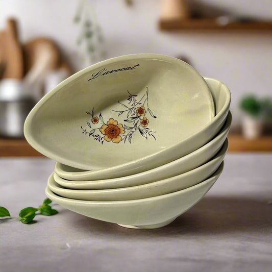 Set of five ceramic bowls with floral design and 'Lavocat' branding on a white background