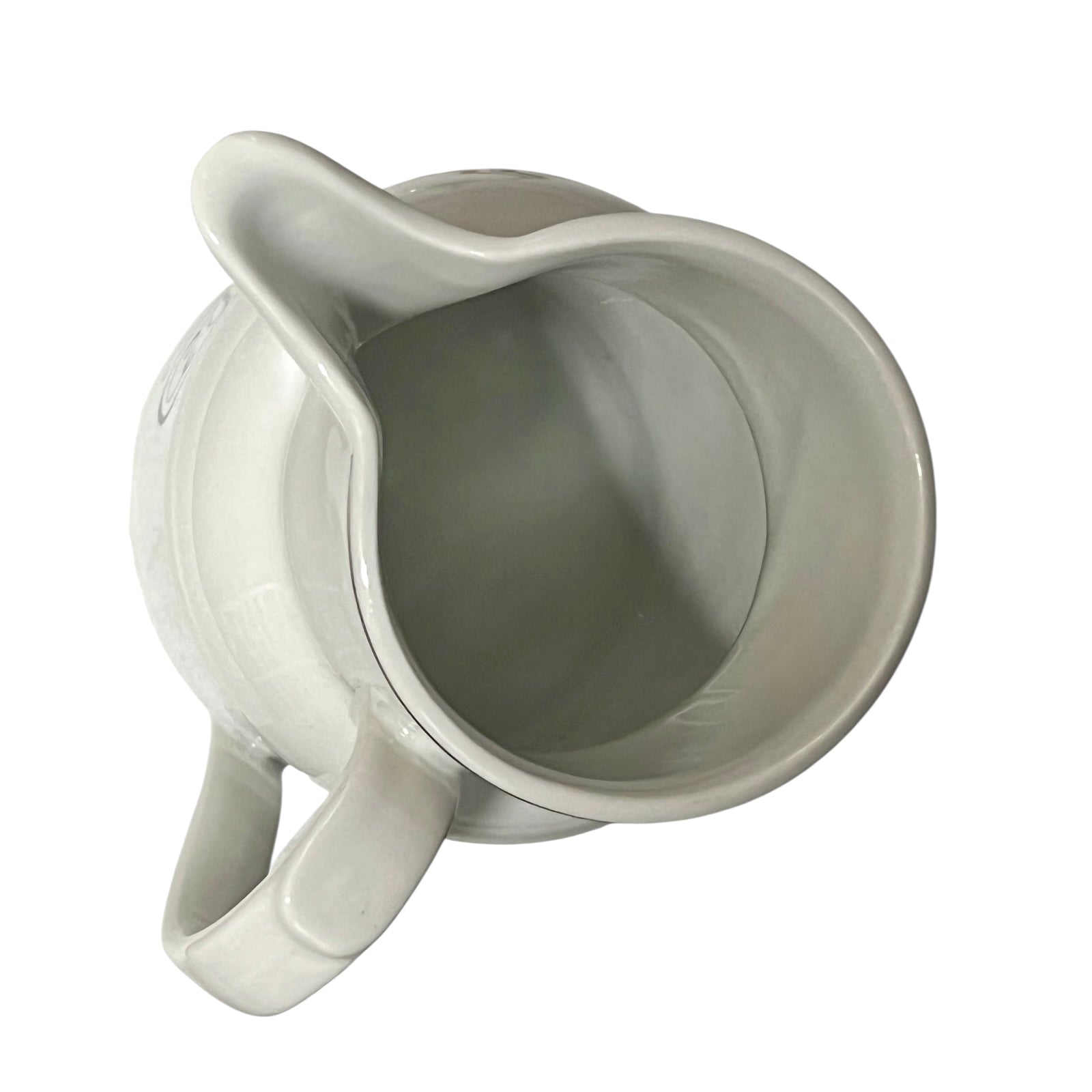 White ceramic pitcher on a white background