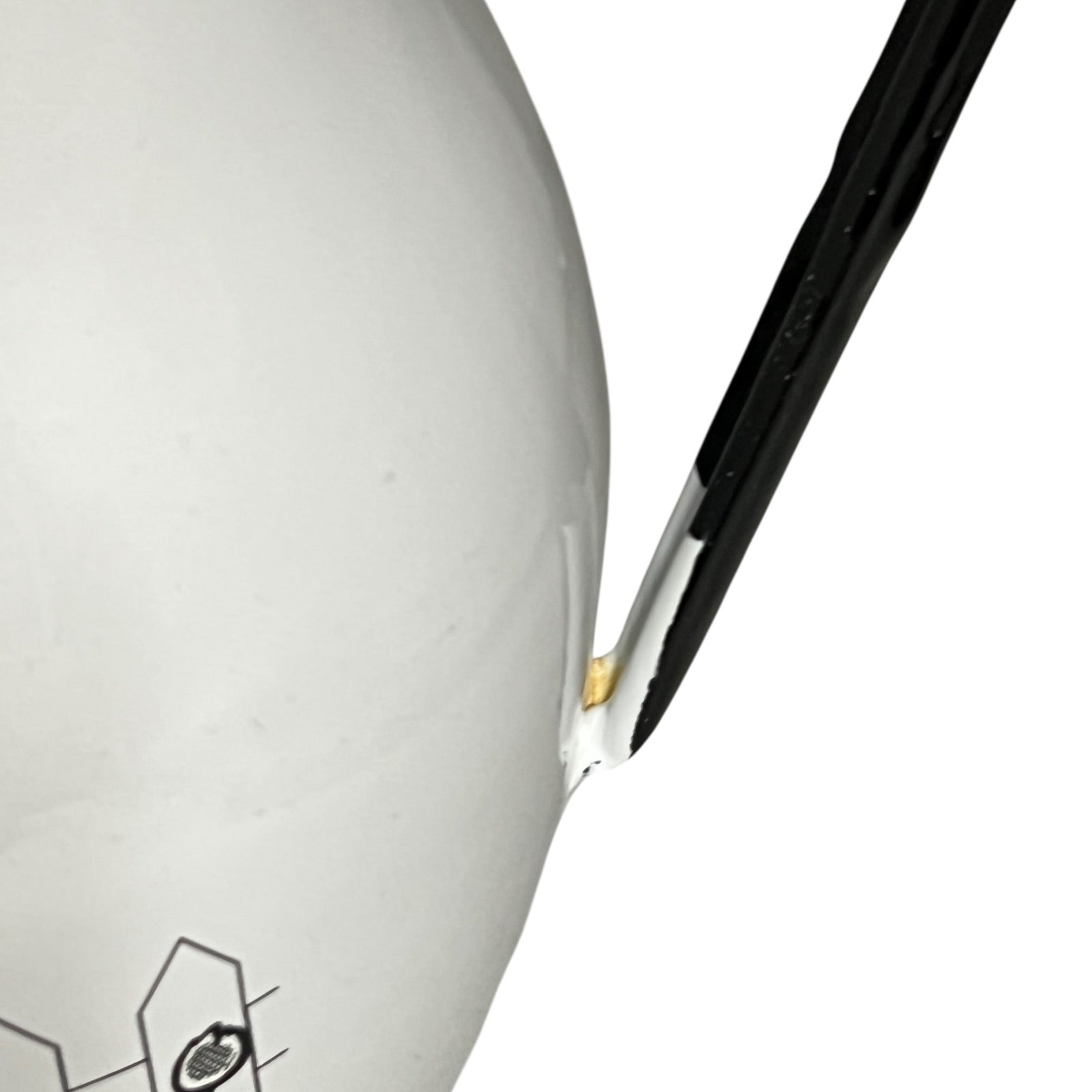 Close-up of a white jug with a black handle on a white background