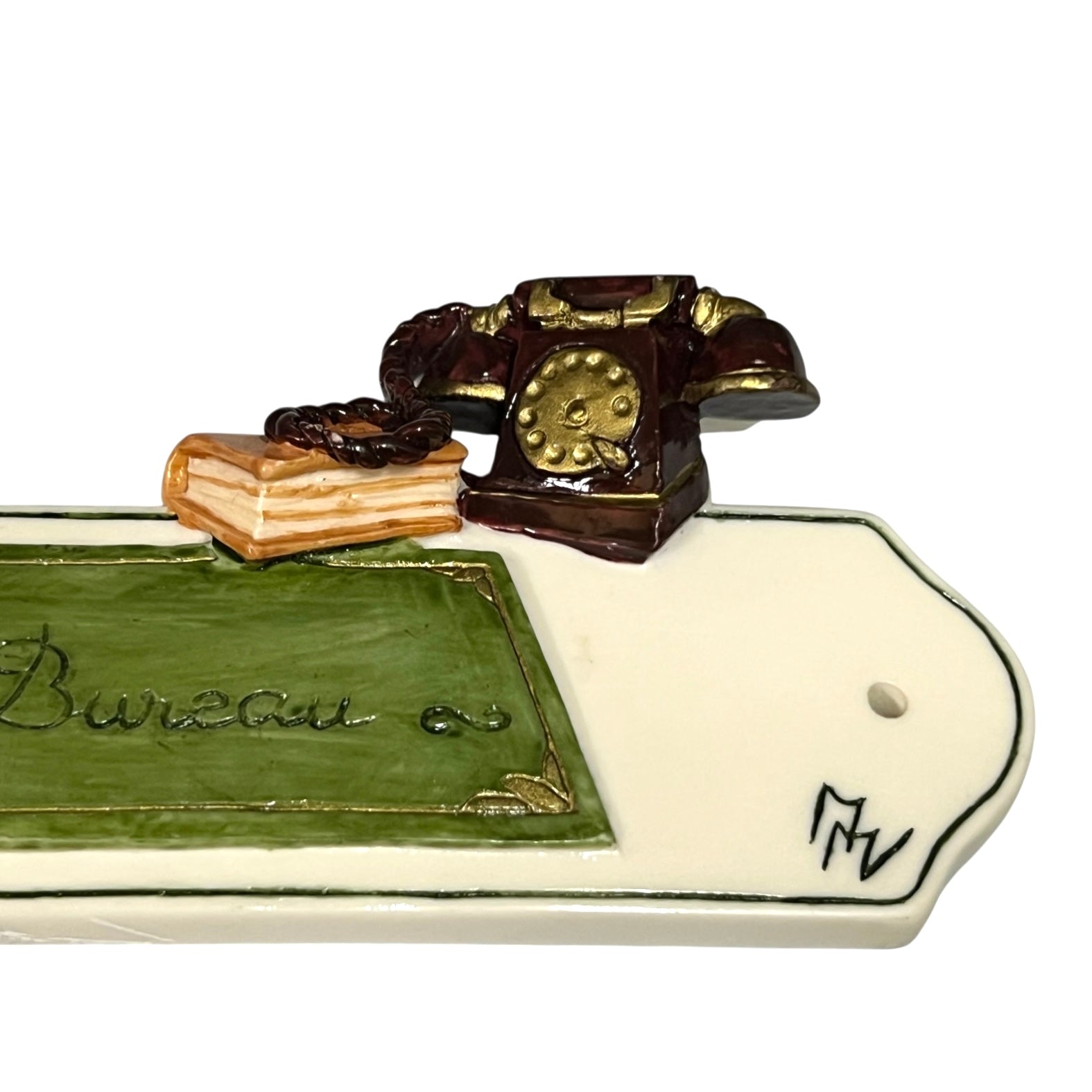 Decorative novelty door sign for an office labelled in French as Bureau, with a telephone, book and pan decoration on a white background