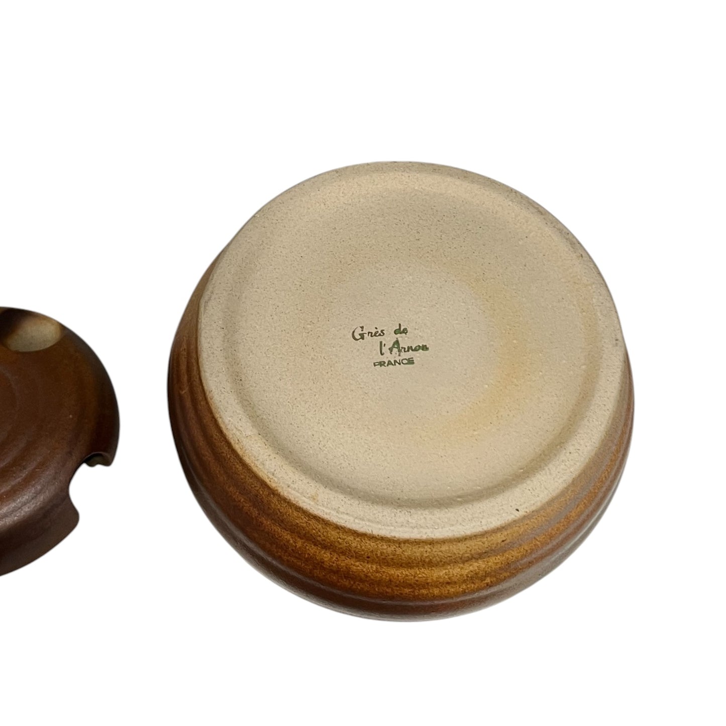 Close-up of a ceramic container with 'Olive' engraved on it, on a white background.