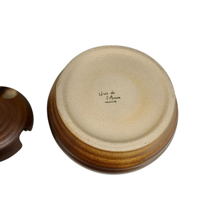 Close-up of a ceramic container with 'Olive' engraved on it, on a white background.