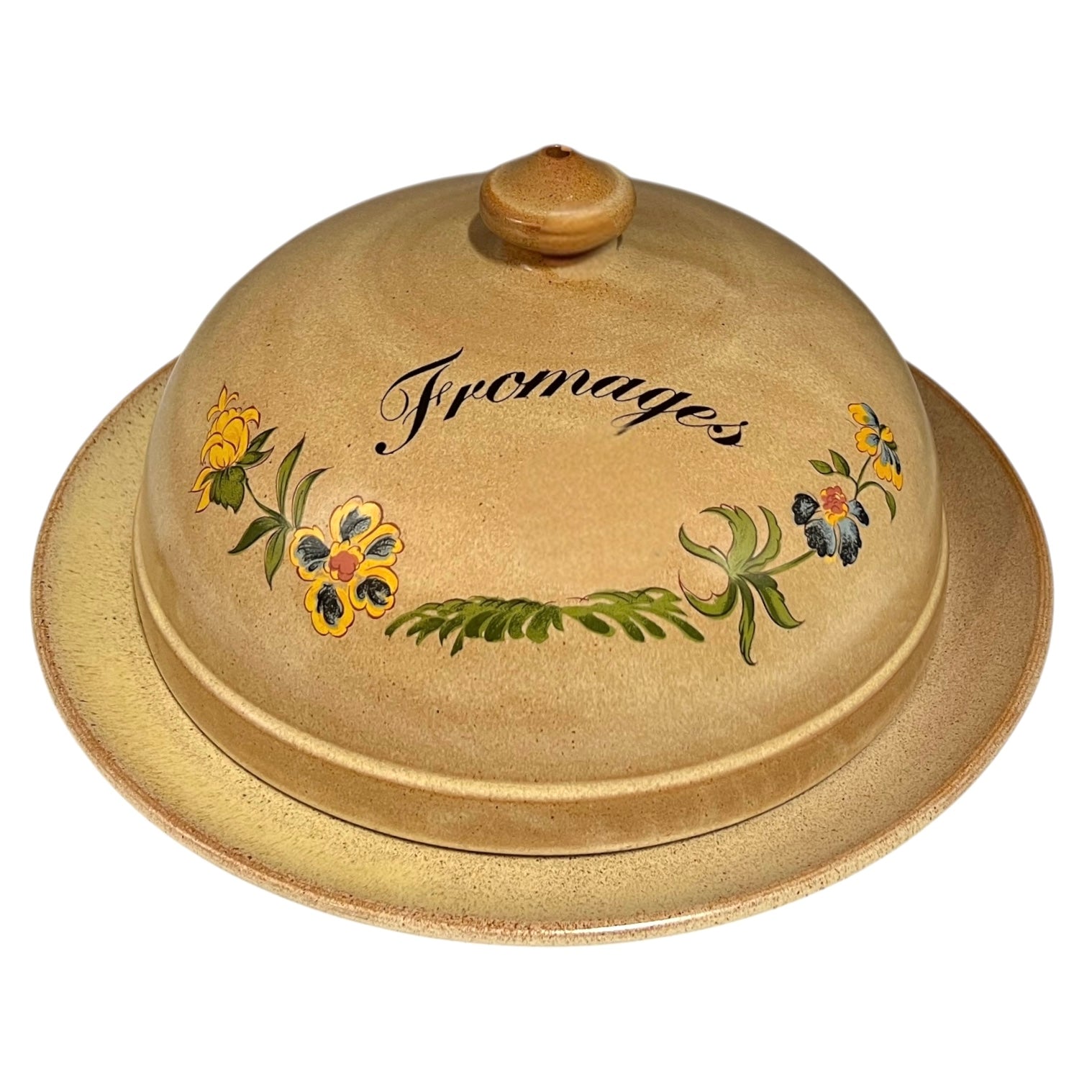 Ceramic cheese dish with floral designs and 'Fromage' text on a white background