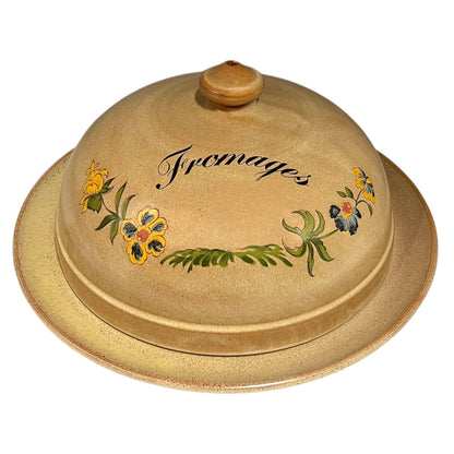 Ceramic cheese dish with floral designs and 'Fromage' text on a white background