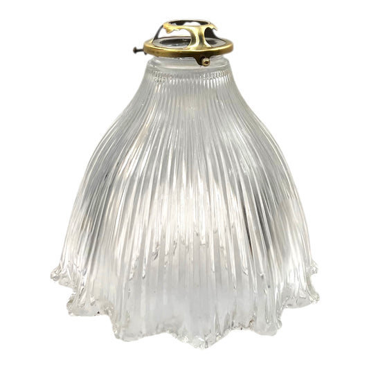 Clear pleated glass pendant light with brass fixture on a white background
