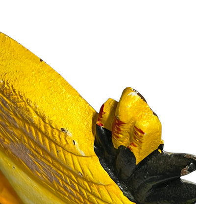 Close up of cast iron doorstop on a white background