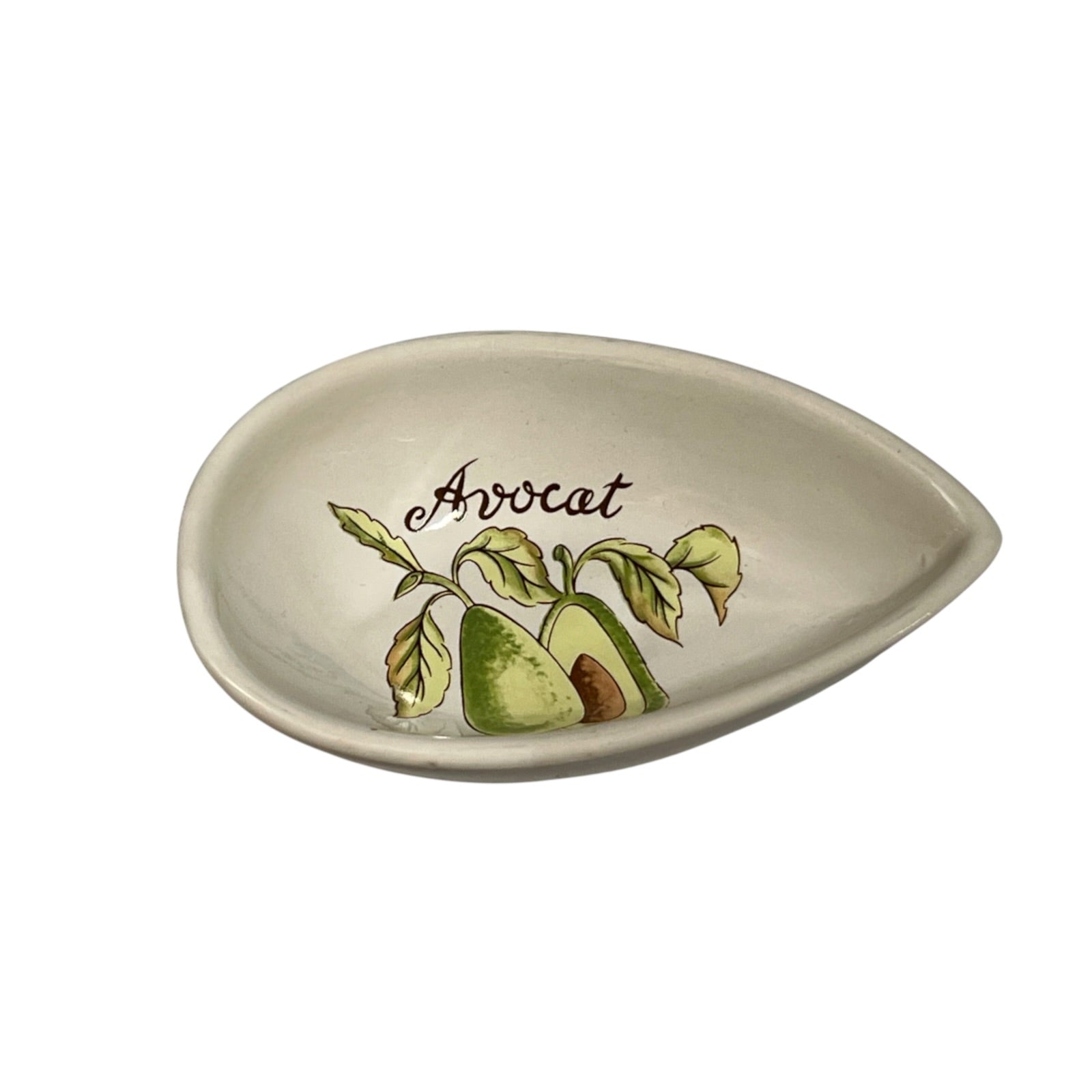 An oval ceramic dish with a teardrop-shaped end, featuring a painted avocado illustration and the word 'Avocat' in black script on a white background.